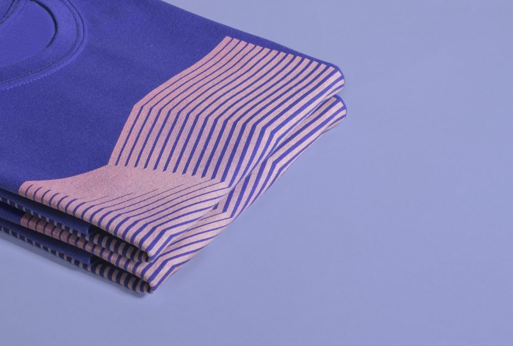 close up on blue folded shirts with illustration