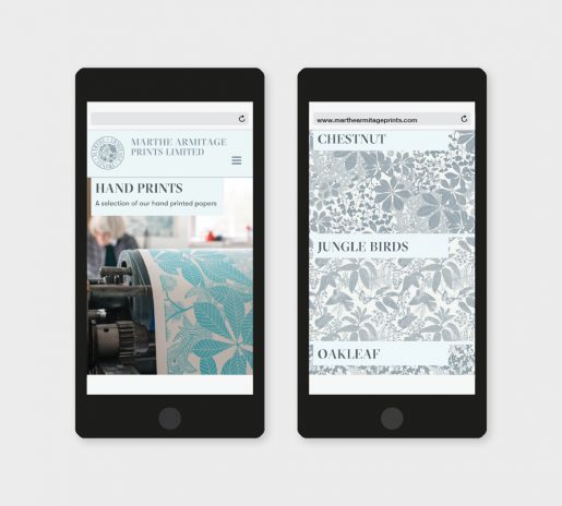 two smartphones with the website design of the homepage and the fabric designs