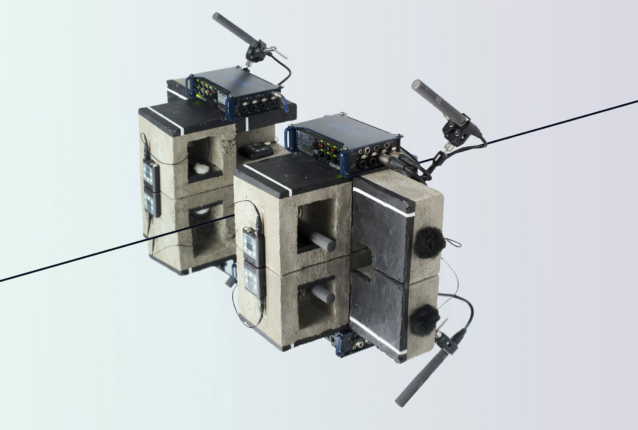 sound recording equipment on concrete blocks against a mirrored background