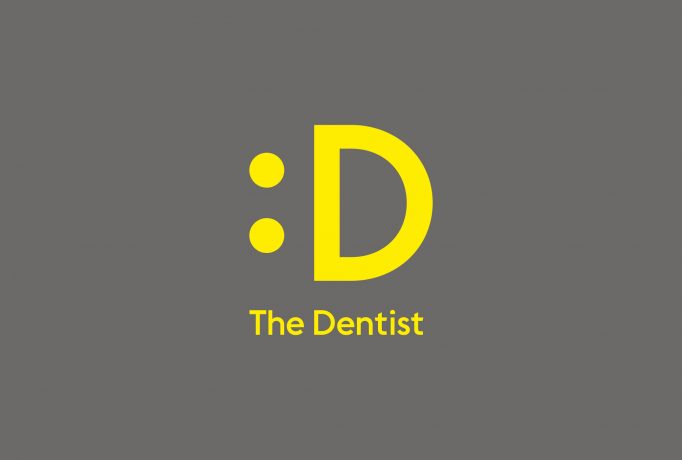 yellow smiley D logo and ‘The Dentist’ written below on a dark grey background