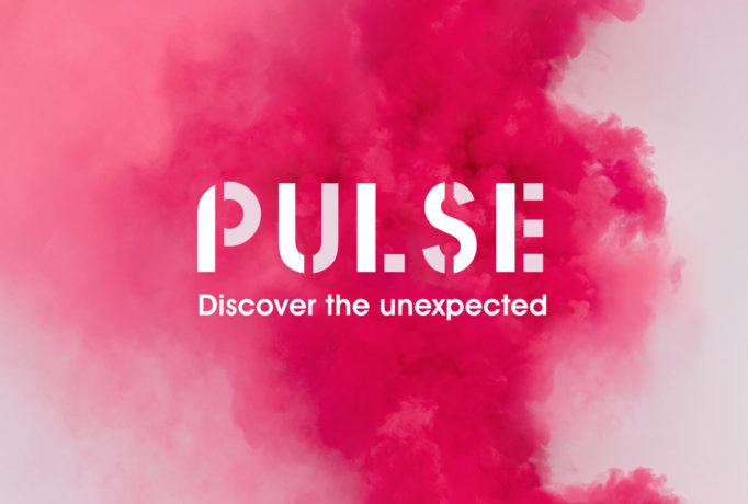 PULSE - Discover the unexpected’ written in white with a thick cloud of pink coloured smoke